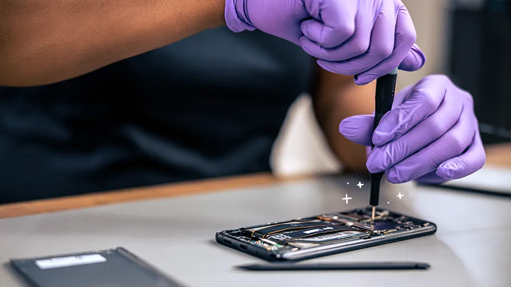 A technician expertly repairing a mobile device, showcasing meticulous care.